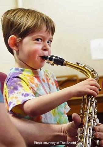 The Shedd Institute Community Music School scholarships, child playing saxophone